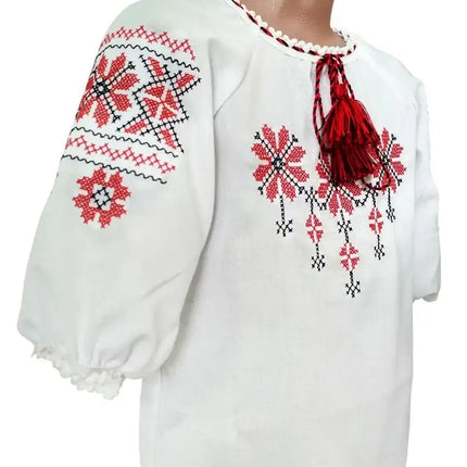Embroidered blouse for a girl with a geometric ornament
