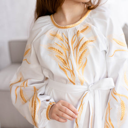 Embroidered dress for a girl with ears of wheat