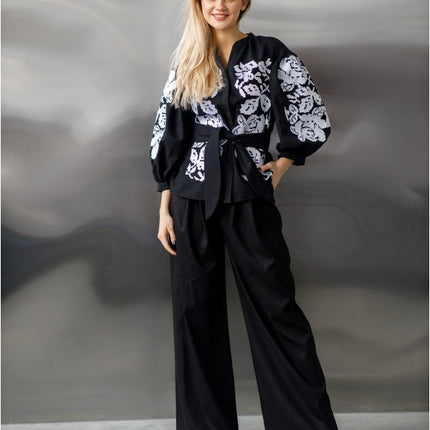 Embroidered women's blouse with a waist belt and button-down style