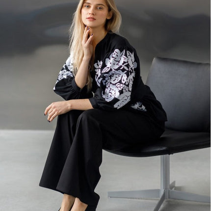 Embroidered women's blouse with a waist belt and button-down style