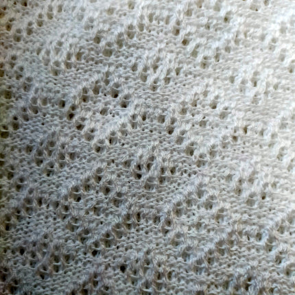 Knitted women's vyshyvanka with a yellow-blue ornament