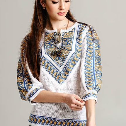 Knitted women's vyshyvanka with a yellow-blue ornament