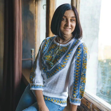 Knitted women's vyshyvanka with a yellow-blue ornament