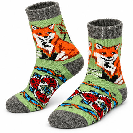 Women’s green sheep wool socks with an orange fox and red and white folk ornament on the foot, made in Ukraine