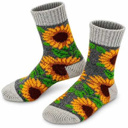 Women’s sheep wool socks with yellow sunflowers on a green leaf background and light gray heels and toes