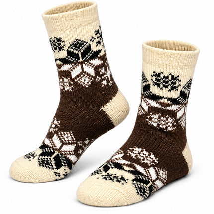 Women’s sheep wool socks with black and white Nordic star ornament on a cream leg and dark brown foot, made in Ukraine