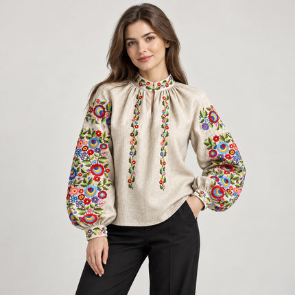 Women's Ukrainian vyshyvanka blouse in natural unbleached linen with bright floral embroidery, front view