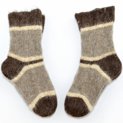 Pair of women’s knitted dog wool socks in gray-beige with brown heels and toes laid side by side