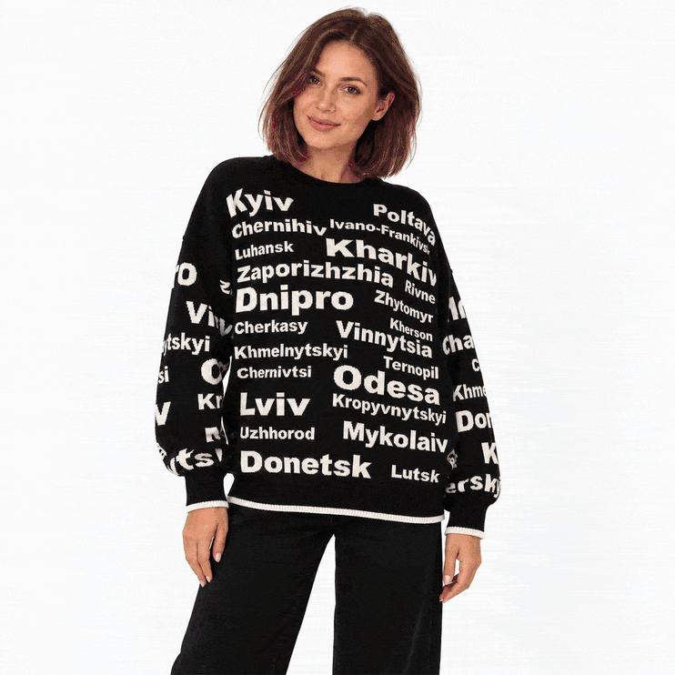 Women’s oversized Ukrainian cities knit sweater in cream with black lettering of Kyiv, Lviv, Odesa and Dnipro