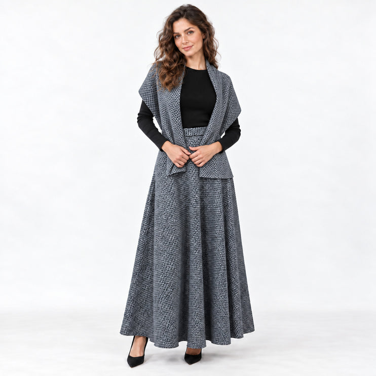 Woman wearing a gray wool blend maxi skirt with a matching gray scarf and a black long-sleeve top