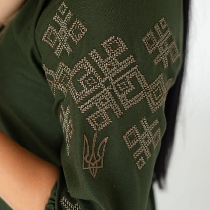 Women's vyshyvanka blouse with embroidered Ukrainian symbols