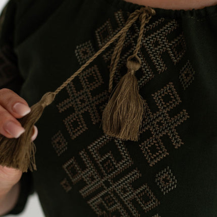 Women's vyshyvanka blouse with embroidered Ukrainian symbols