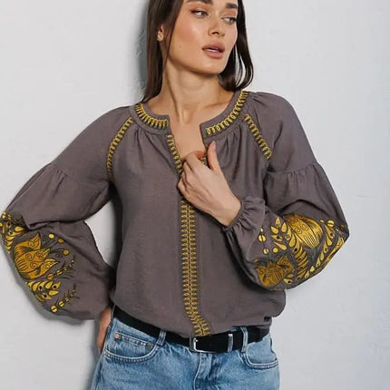 Women's embroidered blouse in graphite color with smooth floral patterns on the sleeves