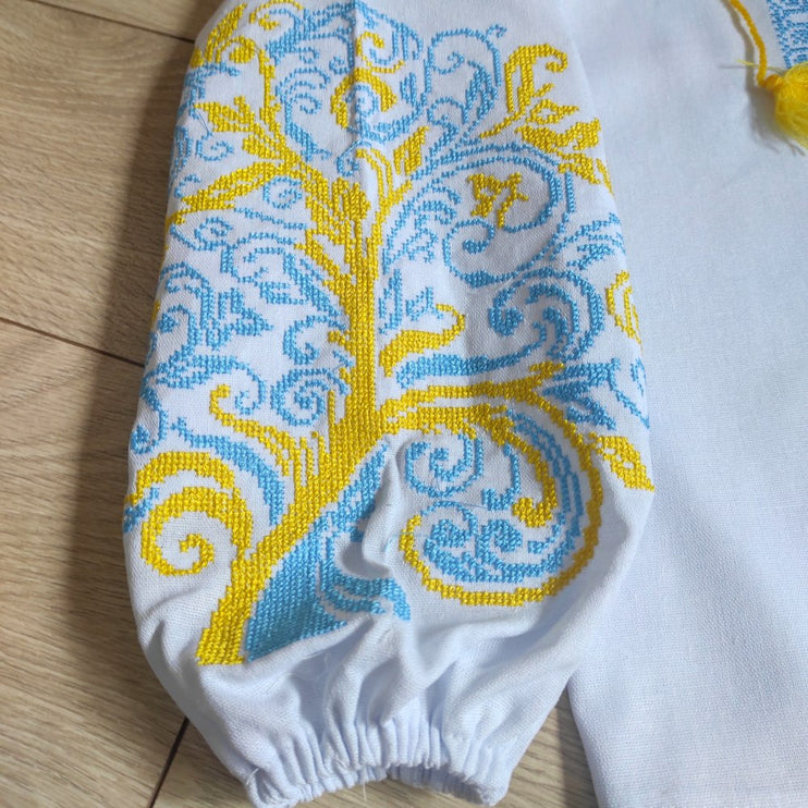 Children's embroidered blouse with yellow and blue embroidery