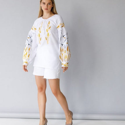 Women's embroidered blouse with swallows and ears of wheat