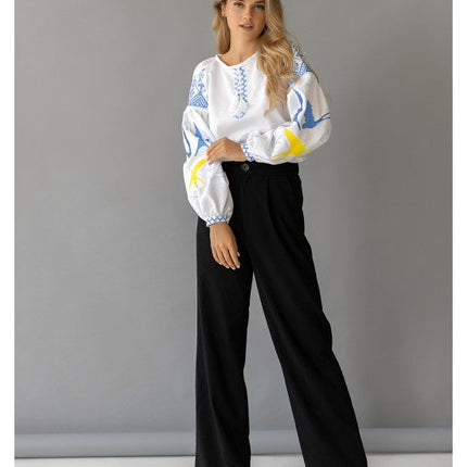 Women's embroidered blouse with swallows in Ukrainian style
