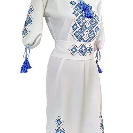 Women's embroidered dress in white color with a geometric ornament