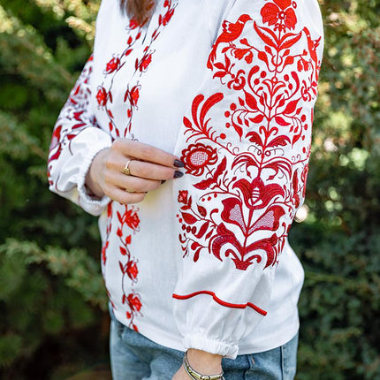 Women's embroidered shirt with a blooming ornament