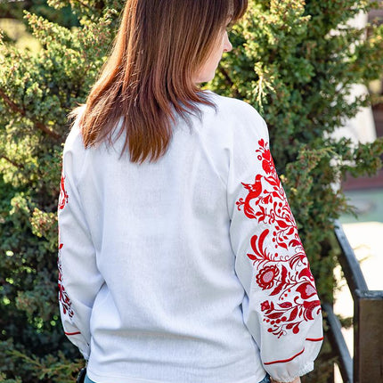 Women's embroidered shirt with a blooming ornament